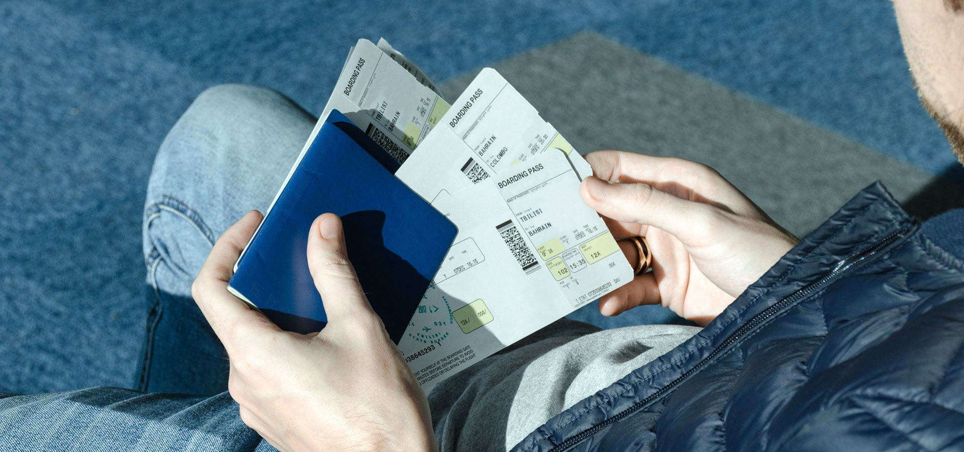 man with airplane tickets and passport 4syce7n.jpg