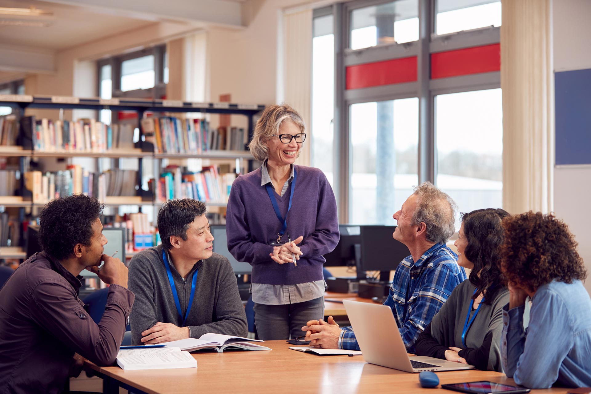 teacher with group of mature adult students in cla 8a84h6b.jpg